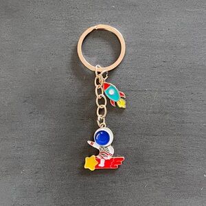 Astronaut Riding Rocket Spaceship Yellow Star Launch Enamel Gold 3.5" Keychain